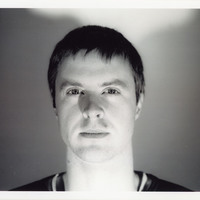 Black-and-white headshot of one of the actors featured in Mac-beth 7 by Pan Pan Theatre Company