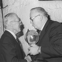 Dr. Brendan O'Regan being presented with an award