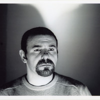 Black-and-white headshot of one of the actors featured in Mac-beth 7 by Pan Pan Theatre Company