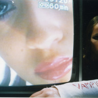 Colour promotional photograph of Katy Davis next to a television for Amy the Vampire and her Sister Martina by Pan Pan Theatre Company