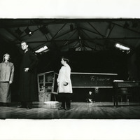 Black-and-white photograph of four actors, of which three prominent in the front of the stage, in Martin Assassin of his Wife by Pan Pan Theatre Company