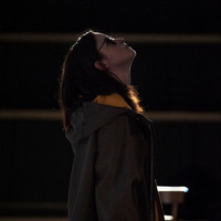 Colour silhouette photograph of Judith Roddy in Everyone is King Lear in His Own Home by Pan Pan Theatre Company