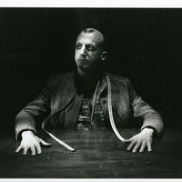 Black-and-white photograph of Charles Kelly as 'The Master' in Tailors Requiem by Pan Pan Theatre Company